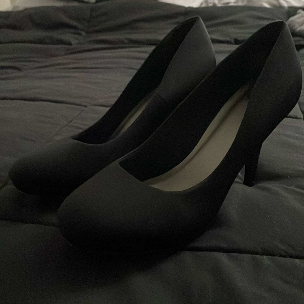Black 4/5 inch heels. never warn